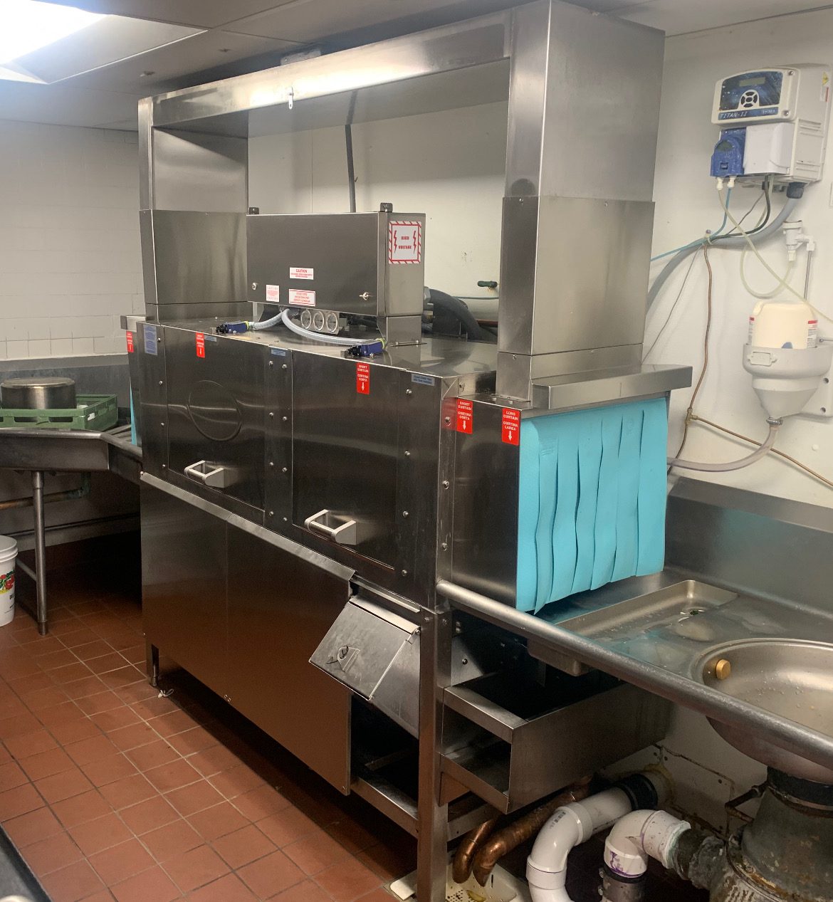 commercial dish washer, in a healthcare facility.
